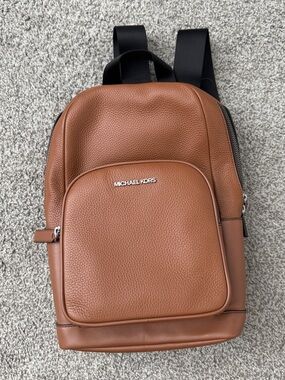 Michael Kors Men’s Cognac Pebbled Leather Sling Pack with Front Zip Pocket
